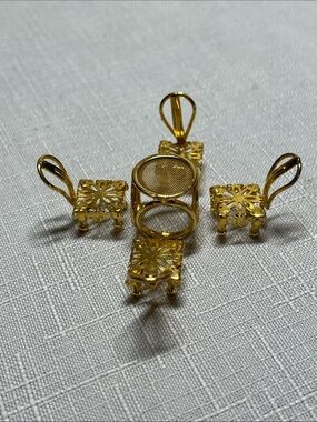 Minitiques dollhouse miniature set 
gold-plated mesh top table
four chairs
